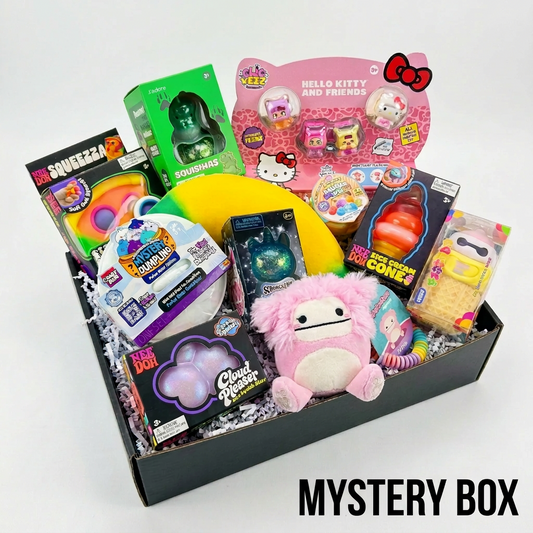 Open black Personalized Mystery Squish Box packed with squishies on white crinkle paper — NeeDoh Cloud Pleaser, Squishasaurus, Hello Kitty ClicKeez, Nice Cream Cone and a pink Bigfoot plush