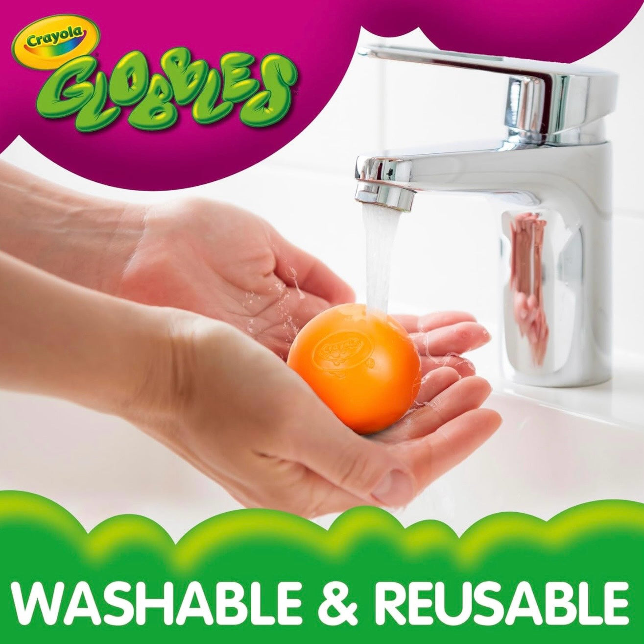 Le Sage May Crayola Globbles sensory ball being rinsed under a faucet to restore stickiness for reusable play.